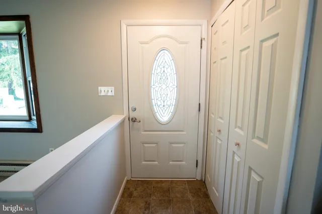 a view of a hallway with windows