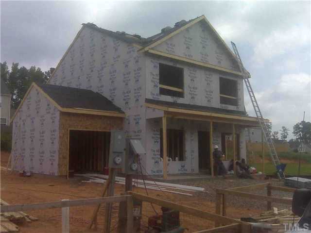 1125 Early Rise Street Raleigh, NC 27610 - Photo 2 of 2 a front view of a house with a garage