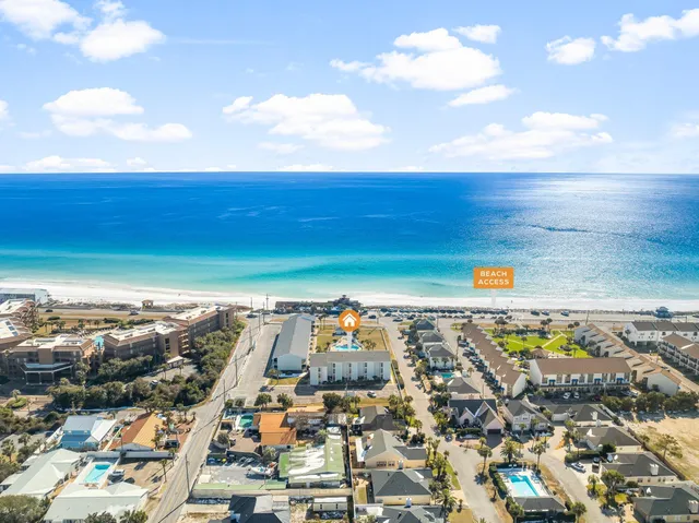 an aerial view of residential building and ocean view