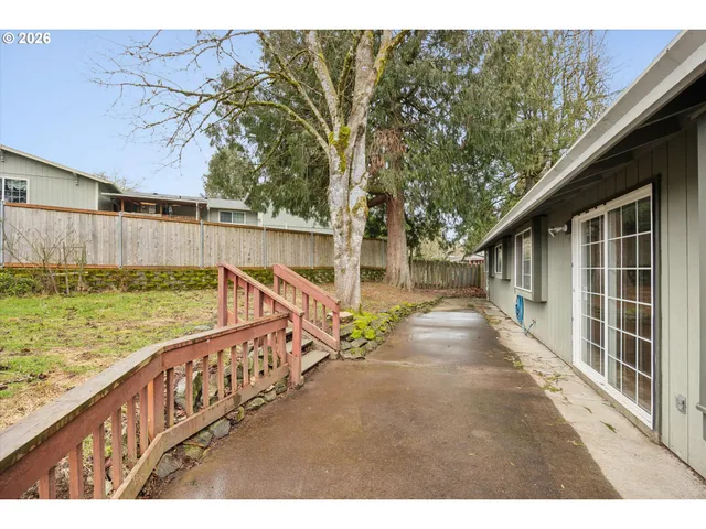 a view of an house with swimming pool and sitting area