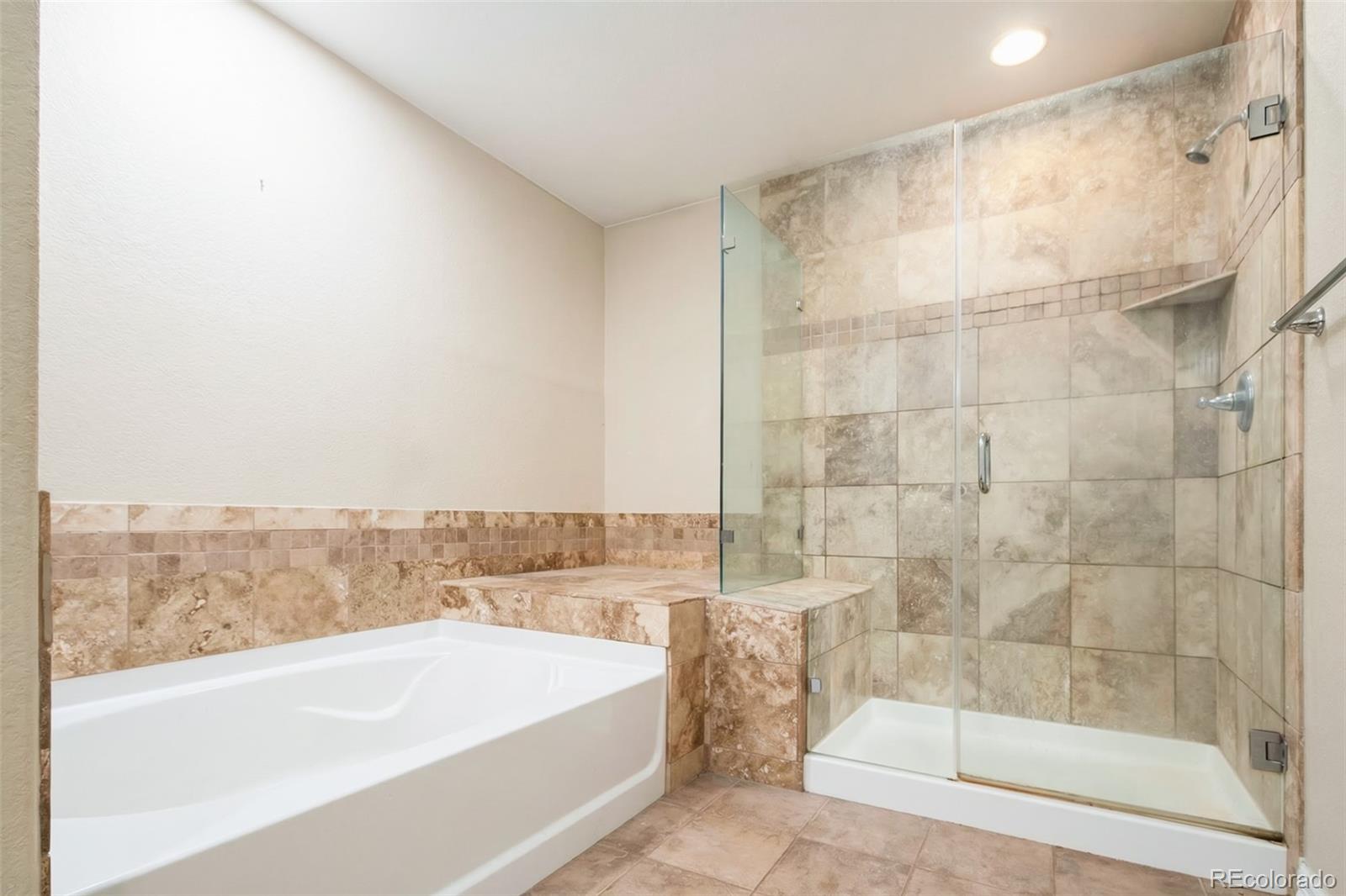 2245 South High Street Denver, CO 80210 - Photo 14 of 33 a bathroom with a bathtub and a shower