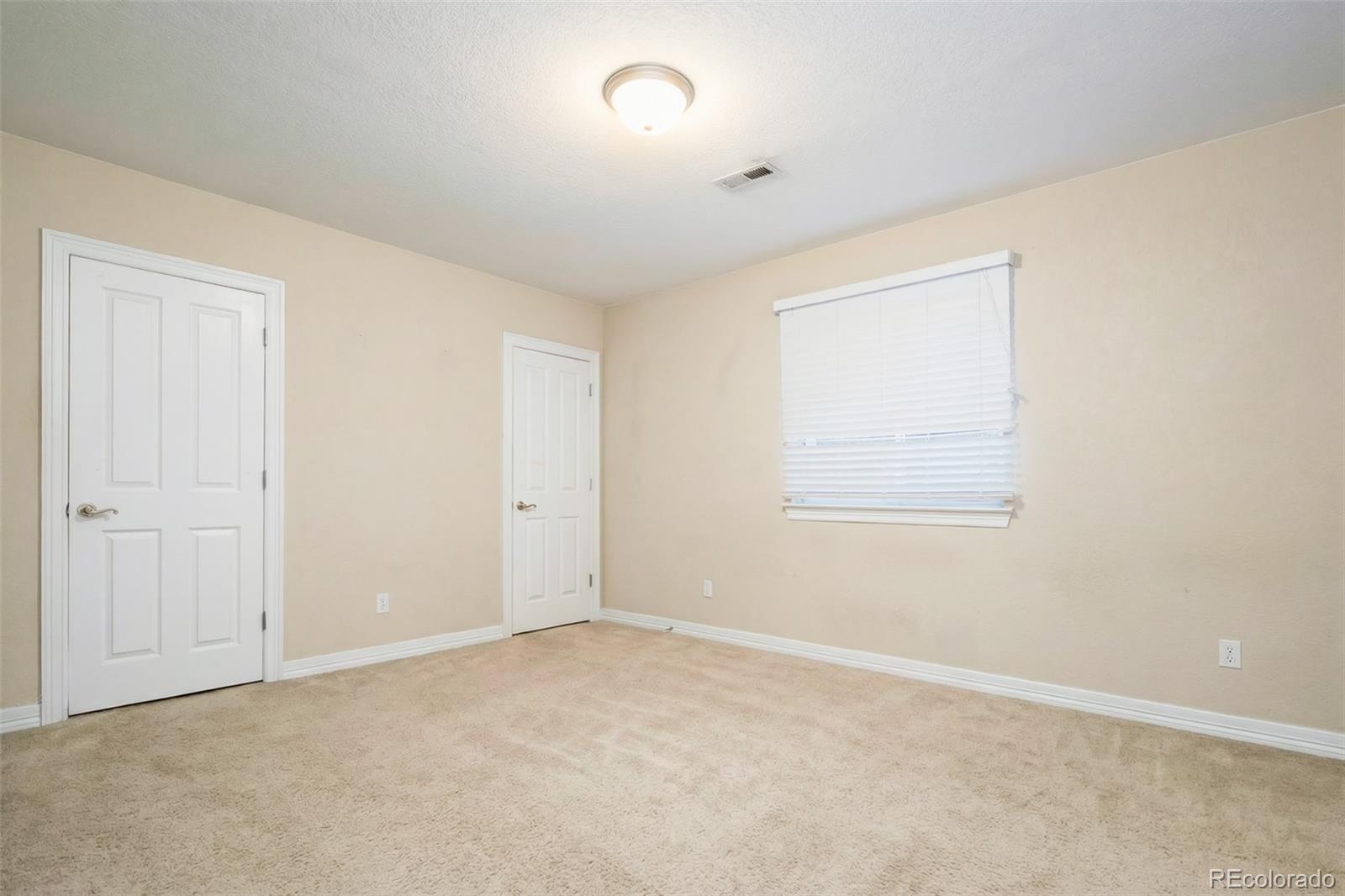2245 South High Street Denver, CO 80210 - Photo 22 of 33 a view of an empty room with a window