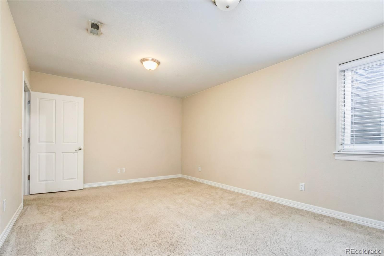 2245 South High Street Denver, CO 80210 - Photo 24 of 33 a view of an empty room and a window