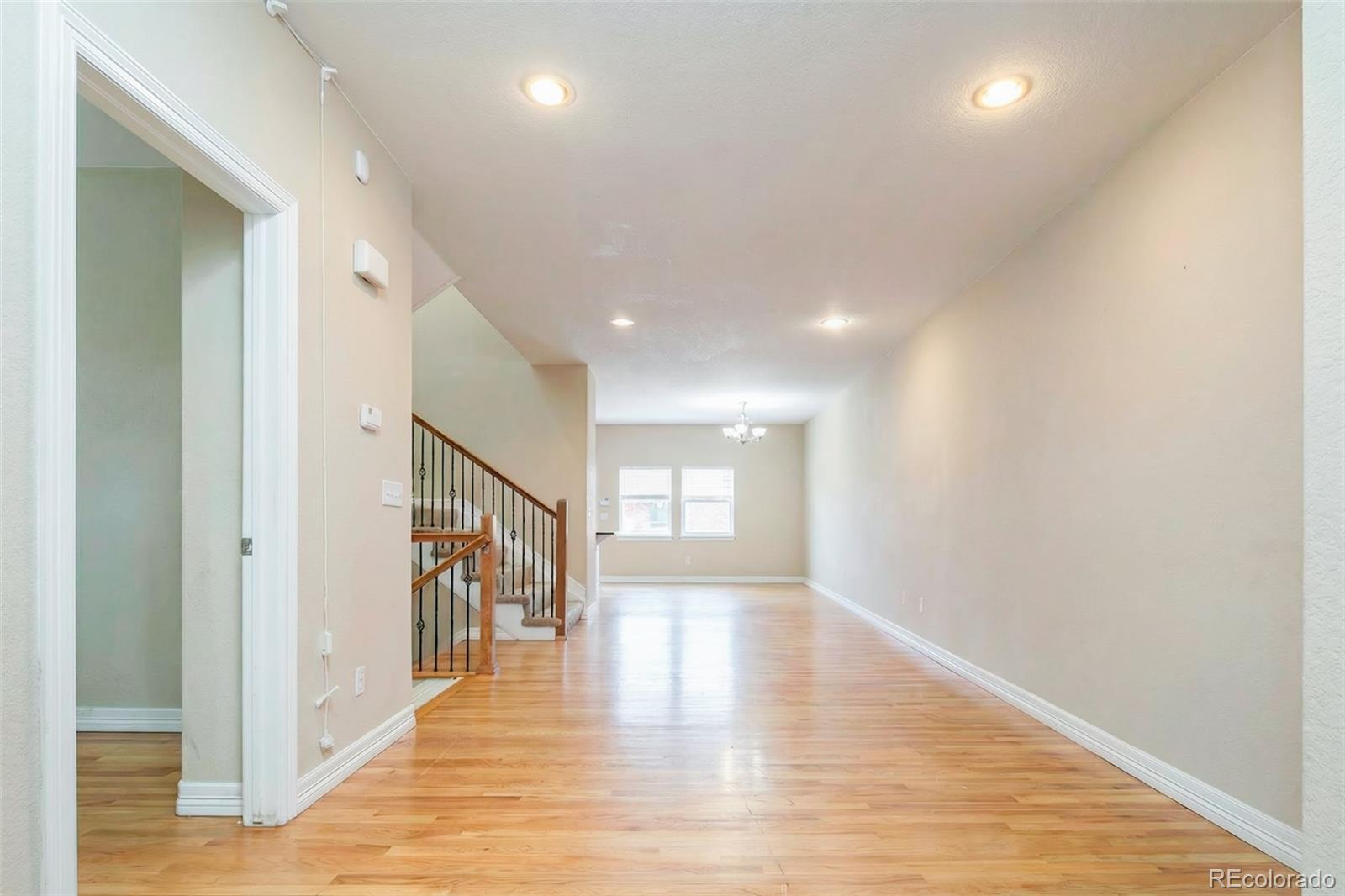 2245 South High Street Denver, CO 80210 - Photo 4 of 33 a view of an entryway with wooden floor