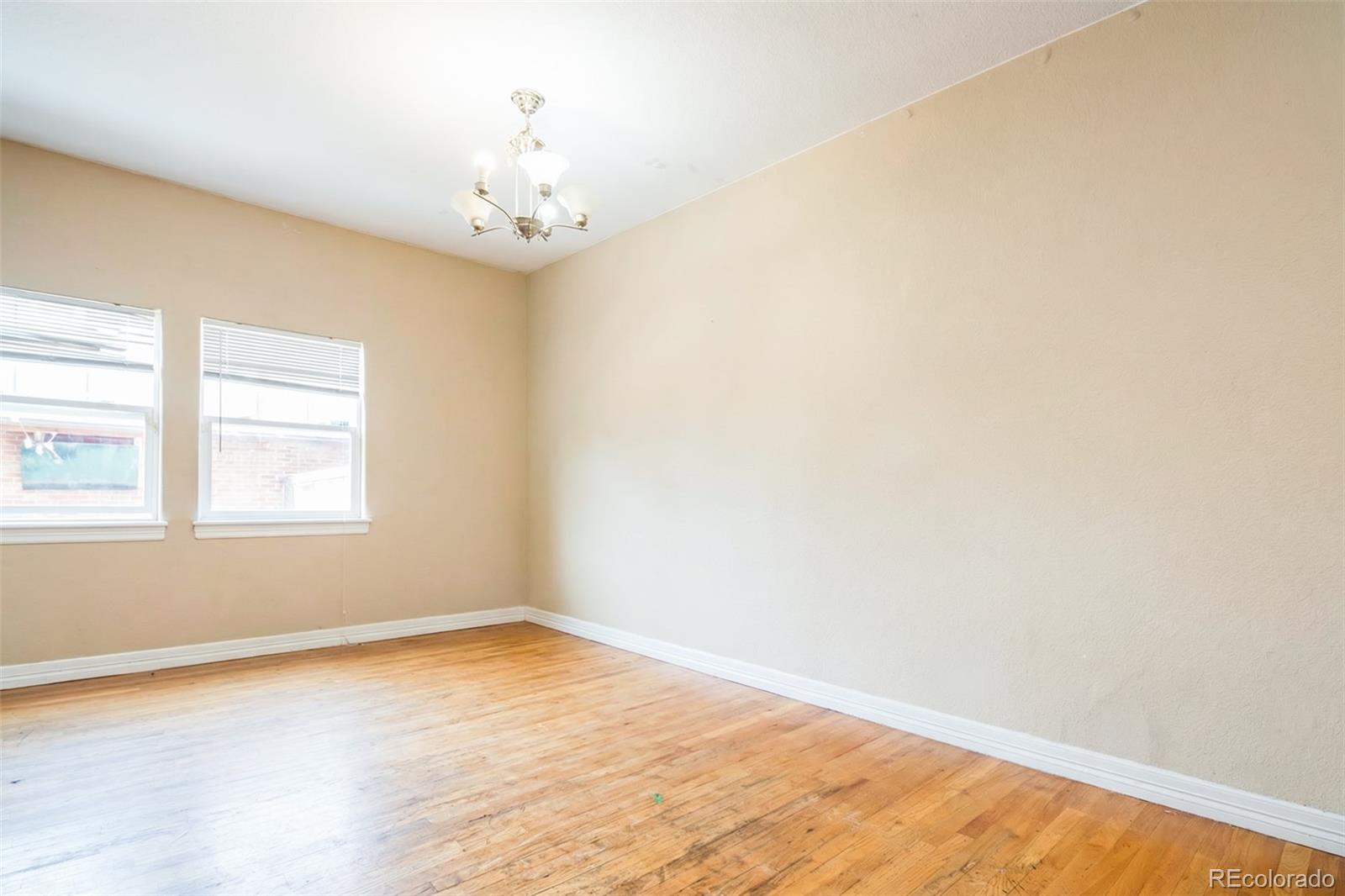 2245 South High Street Denver, CO 80210 - Photo 5 of 33 an empty room with a window