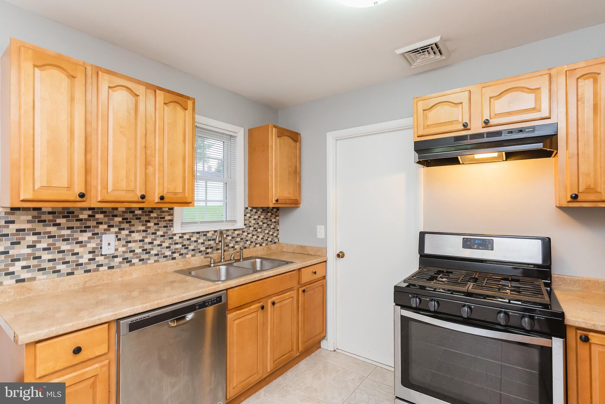 1925 Bayberry Road Edgewood, MD 21040 - Photo 15 of 35 a kitchen with stainless steel appliances granite countertop a sink stove and cabinets