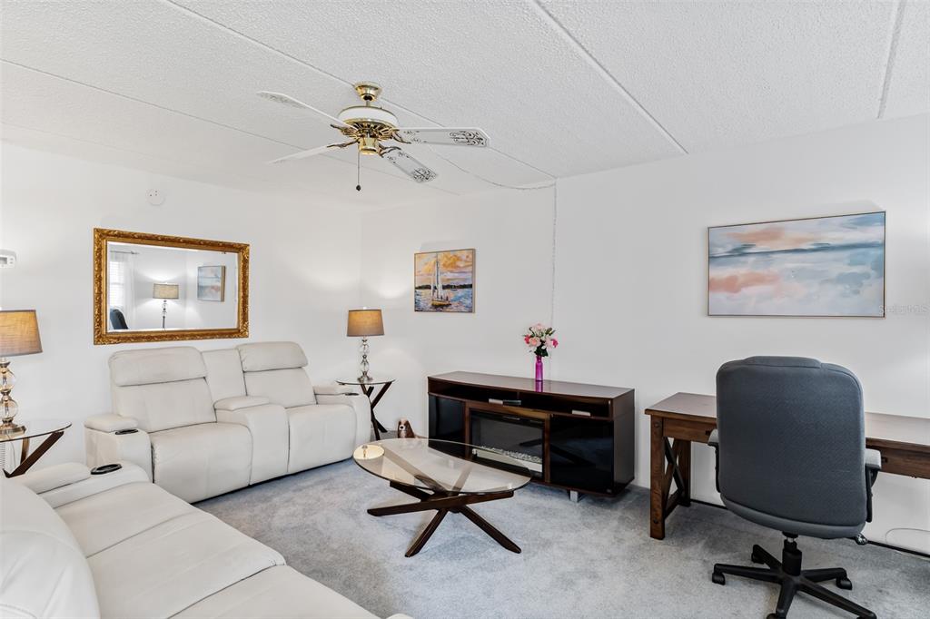 12760 Indian Rocks Road, Unit 546 Largo, FL 33774 - Photo 11 of 45 a view of a livingroom with workspace and a couch