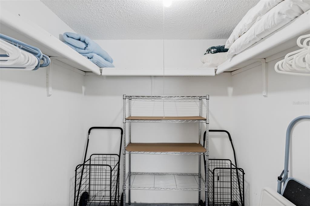 12760 Indian Rocks Road, Unit 546 Largo, FL 33774 - Photo 14 of 45 a view of storage and utility room with racks on the wall