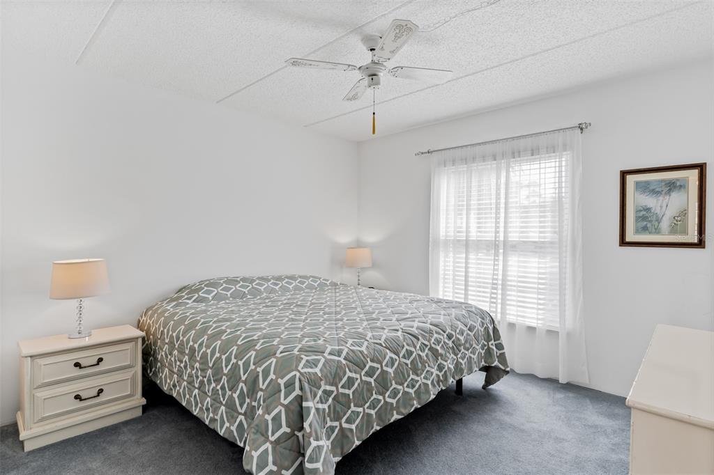 12760 Indian Rocks Road, Unit 546 Largo, FL 33774 - Photo 20 of 45 a bedroom with a bed and a window