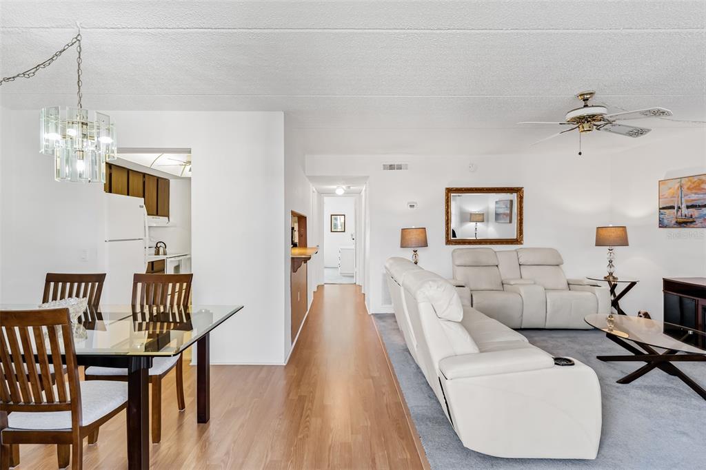 12760 Indian Rocks Road, Unit 546 Largo, FL 33774 - Photo 2 of 45 a living room with furniture and a wooden floor