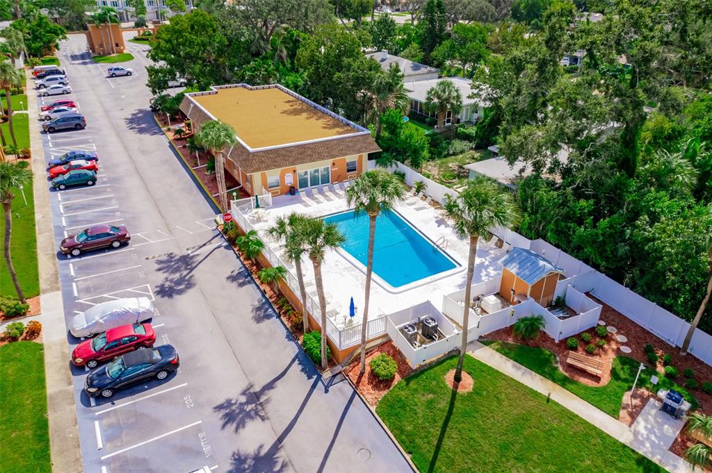 12760 Indian Rocks Road, Unit 546 Largo, FL 33774 - Photo 28 of 45 an aerial view of a house with a garden and trees
