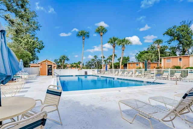 a view of a swimming pool with a patio