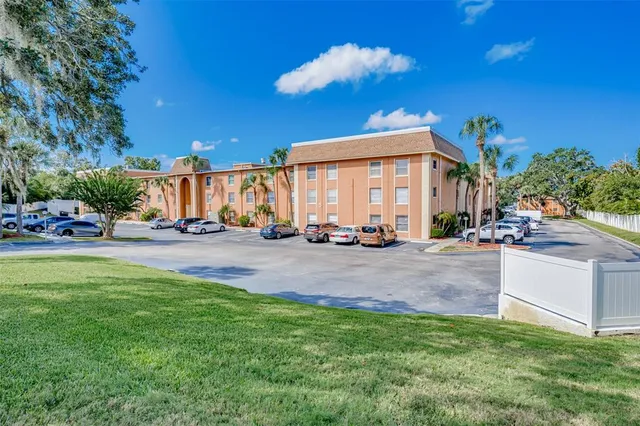 a view of a building with a yard