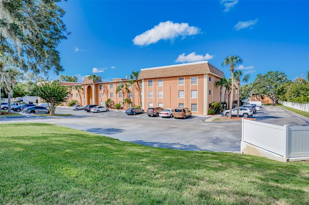 12760 Indian Rocks Road, Unit 546 Largo, FL 33774 - Photo 32 of 45 a view of a building with a yard