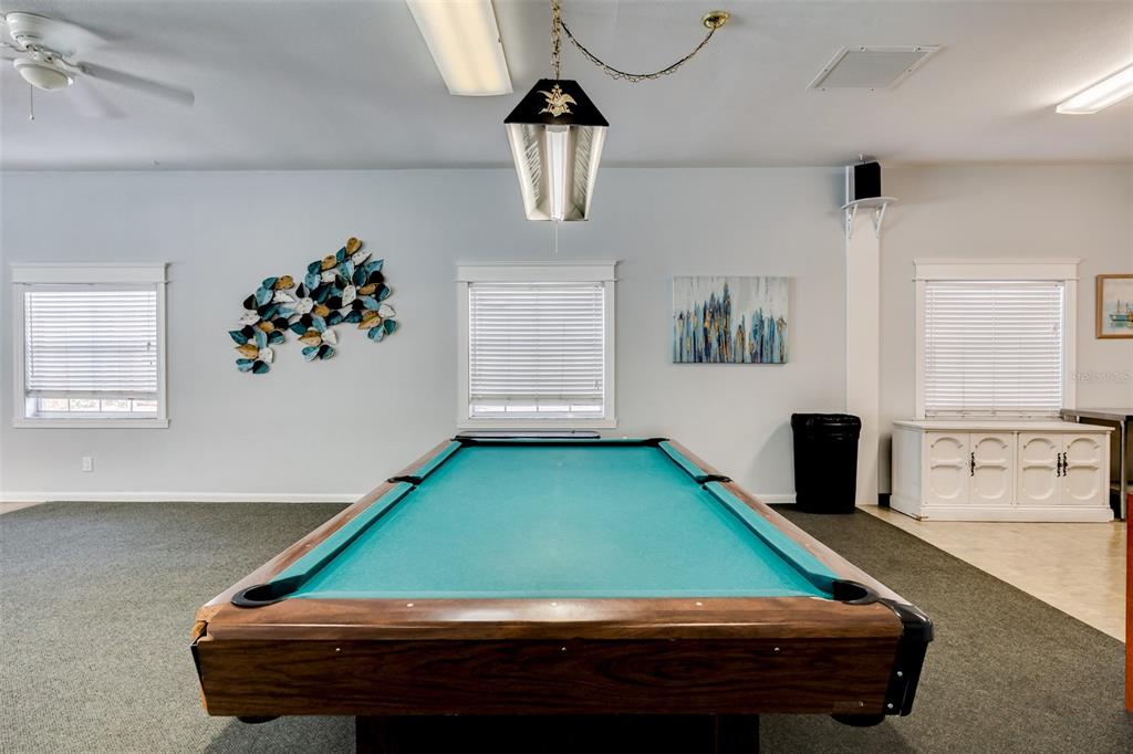12760 Indian Rocks Road, Unit 546 Largo, FL 33774 - Photo 39 of 45 a room with pool table and windows