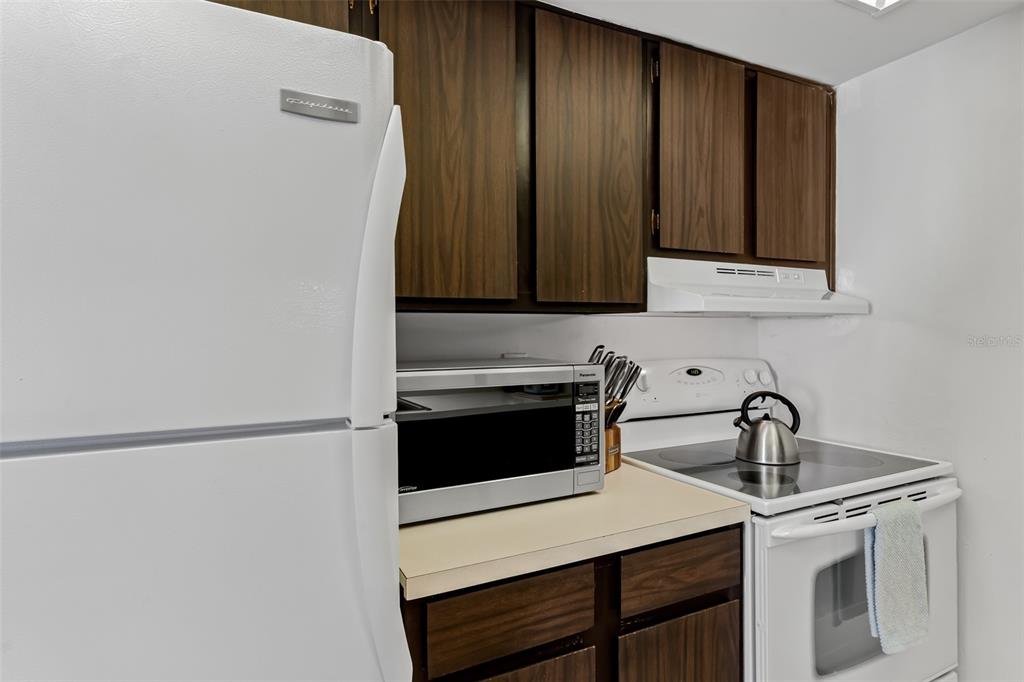 12760 Indian Rocks Road, Unit 546 Largo, FL 33774 - Photo 9 of 45 a kitchen with a sink cabinets and appliances