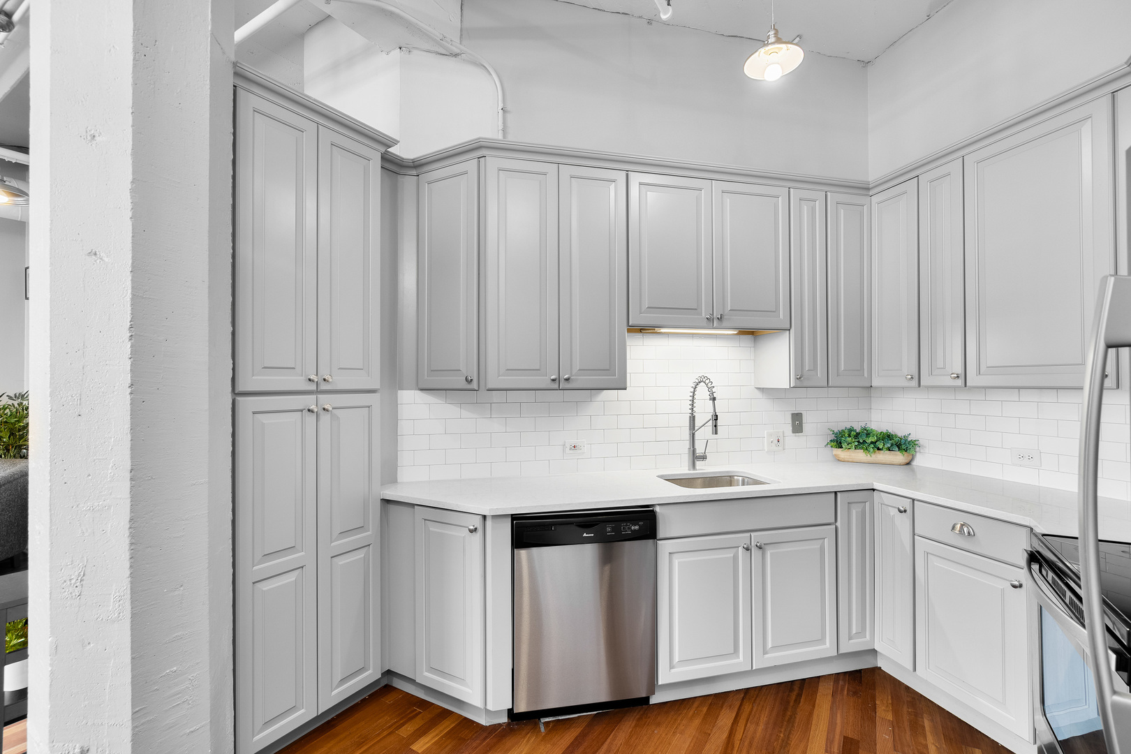 124 West Polk Street, Unit 905 Chicago, IL 60605 - Photo 9 of 28 a kitchen with white cabinets and white appliances