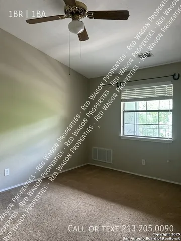 a view of a house with garden space and a patio
