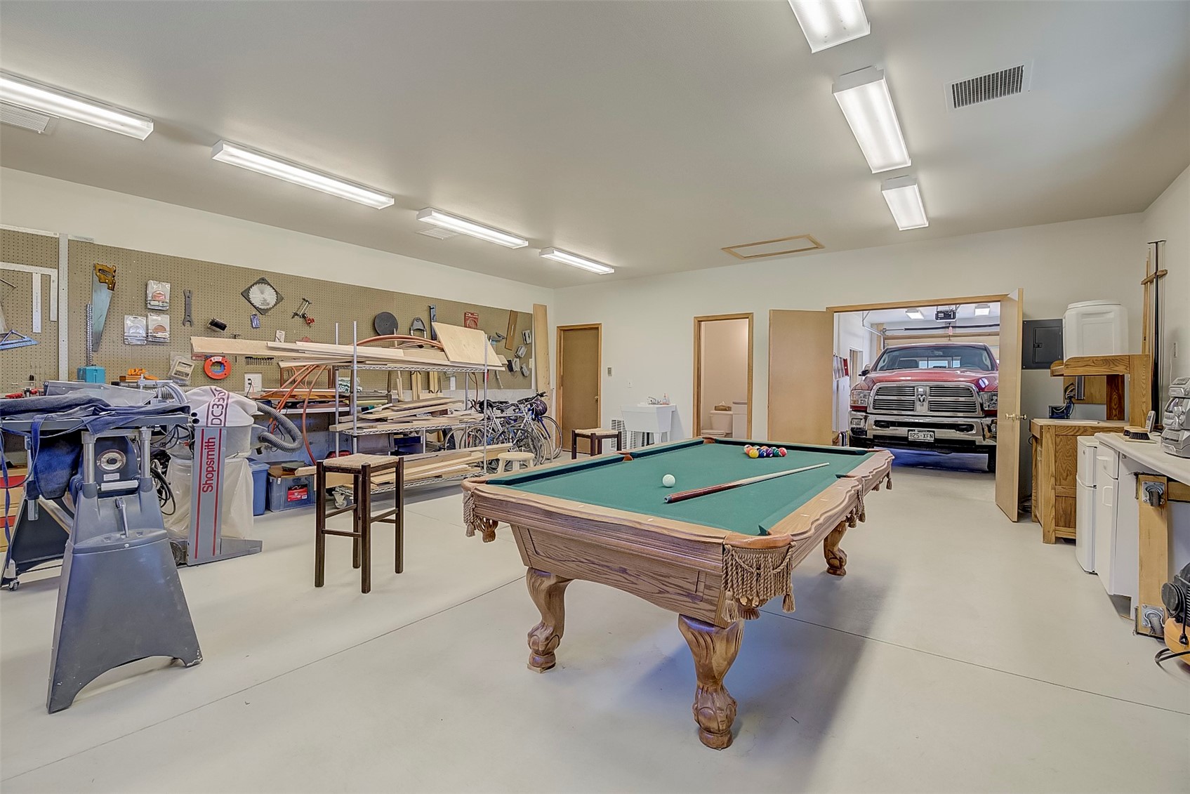 1228 Emerald Road Silverthorne, CO 80498 - Photo 45 of 50 The shop in the back of the garage doubles as a man cave