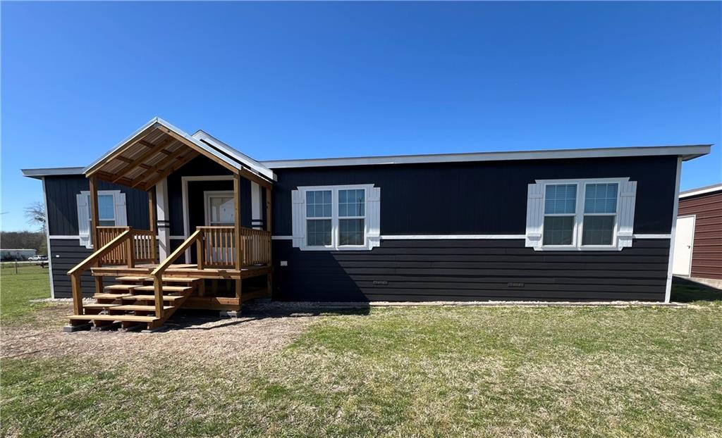 161 Meadow View Lane Hubbard, TX 76648 - Photo 1 of 16 a front view of a house with a garden