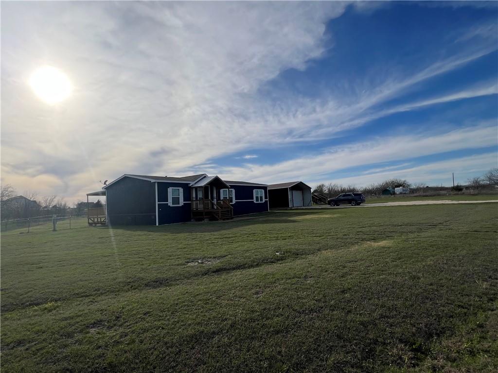 161 Meadow View Lane Hubbard, TX 76648 - Photo 11 of 16 a view of a big house in a big yard with large trees