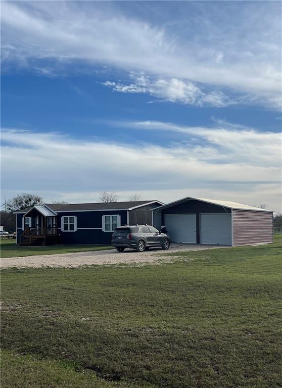 161 Meadow View Lane Hubbard, TX 76648 - Photo 12 of 16 a view of a large swimming pool with lawn chairs and large trees