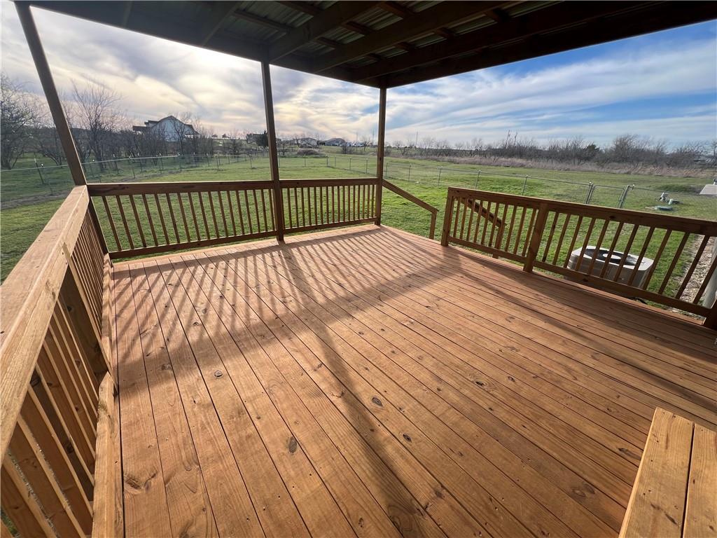 161 Meadow View Lane Hubbard, TX 76648 - Photo 14 of 16 a view of balcony with couch on floor