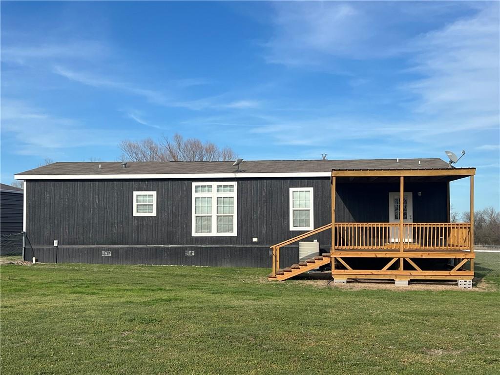 161 Meadow View Lane Hubbard, TX 76648 - Photo 5 of 16 a view of a house with backyard and trees