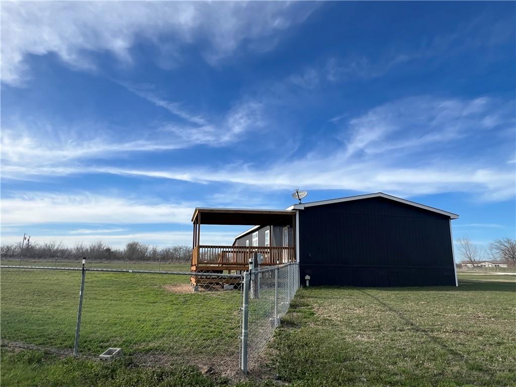 161 Meadow View Lane Hubbard, TX 76648 - Photo 6 of 16 a backyard of a house with table and chairs