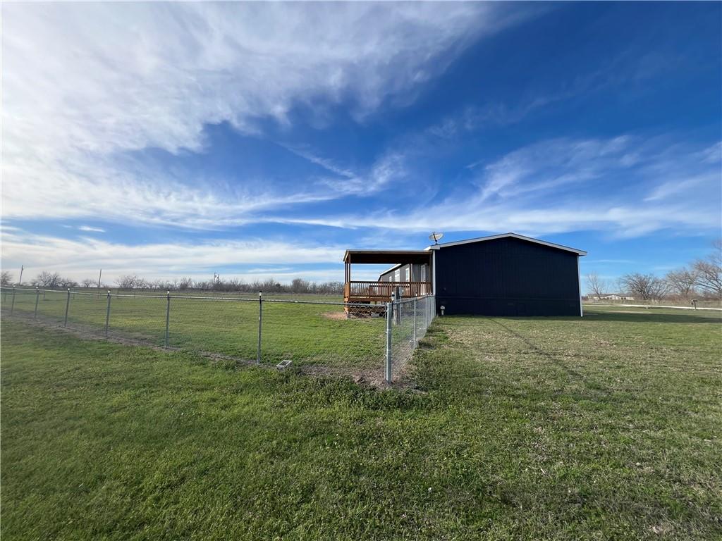 161 Meadow View Lane Hubbard, TX 76648 - Photo 7 of 16 a backyard of a house with lots of green space and mountain view in back