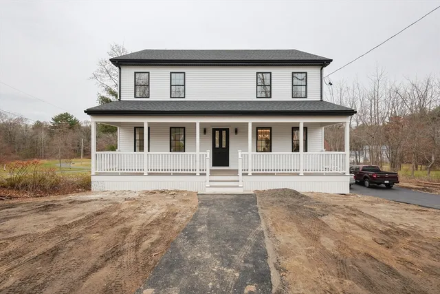 a house that has a large window in front of it