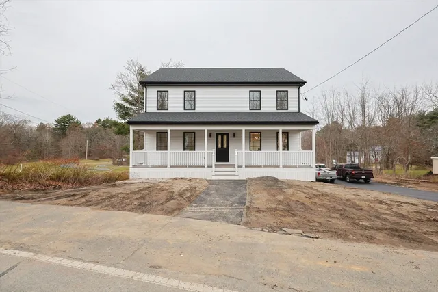 a view of a car park in front of house