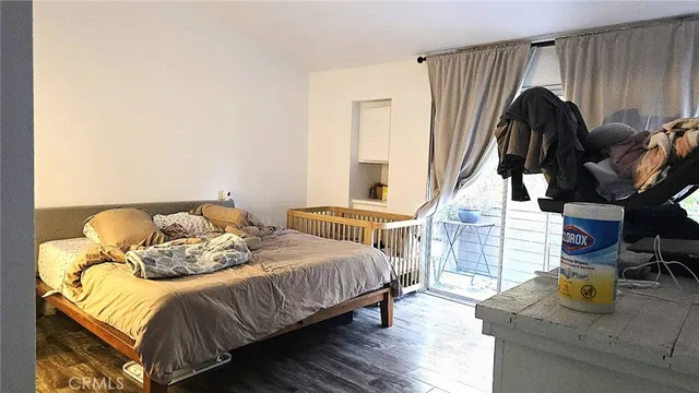 a bedroom with a bed and walk in closet