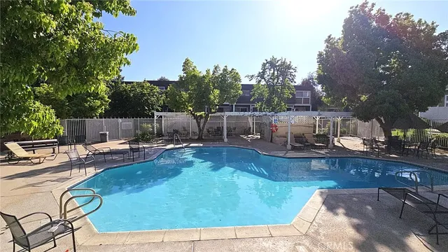 a view of a backyard with large trees
