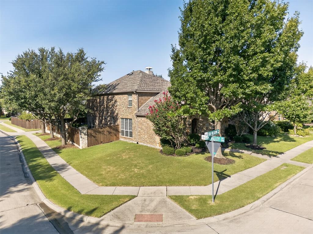 842 Sun Meadow Road Allen, TX 75013 - Photo 32 of 39 Corner lot residence featuring a brick exterior and a shingled roof