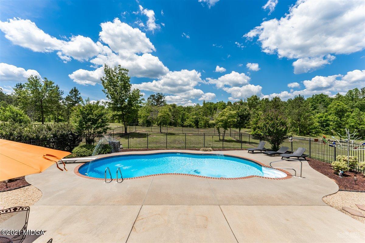 1900 Smith Road Forsyth, GA 31029 - Photo 20 of 28 a view of a swimming pool and lounge chairs