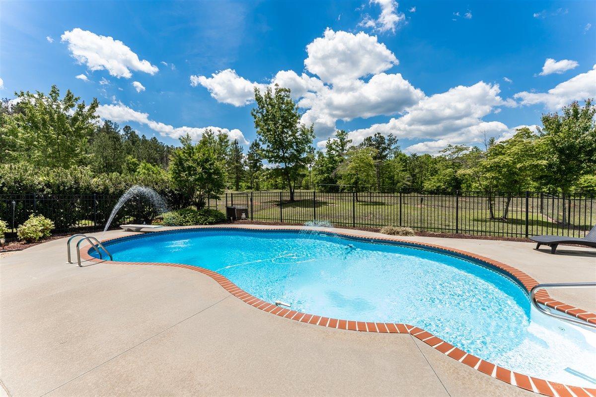 1900 Smith Road Forsyth, GA 31029 - Photo 21 of 28 a view of a swimming pool with a patio and a yard