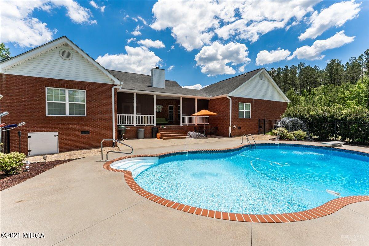 1900 Smith Road Forsyth, GA 31029 - Photo 23 of 28 a view of a house with swimming pool and a dining space