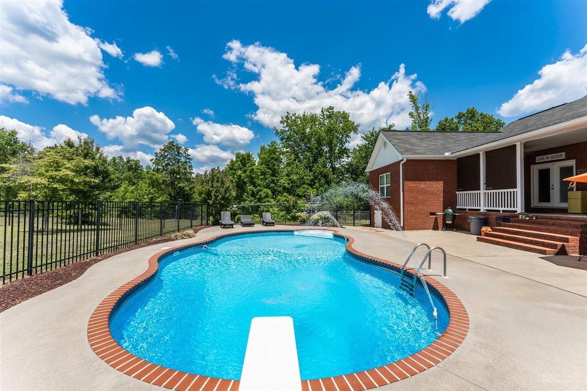 1900 Smith Road Forsyth, GA 31029 - Photo 24 of 28 a view of a swimming pool with a patio