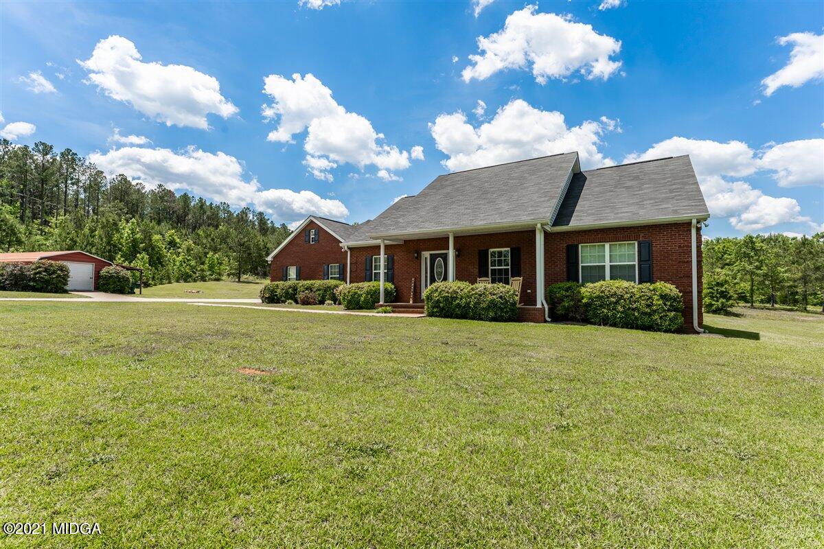 1900 Smith Road Forsyth, GA 31029 - Photo 28 of 28 a front view of a house with garden