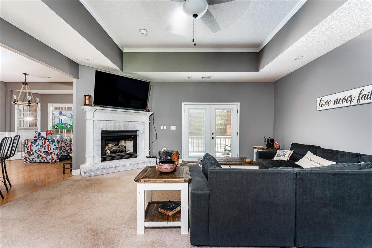 1900 Smith Road Forsyth, GA 31029 - Photo 7 of 28 a living room with furniture a flat screen tv and a fireplace