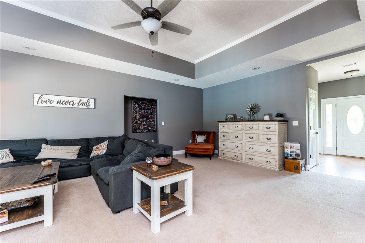 1900 Smith Road Forsyth, GA 31029 - Photo 8 of 28 a living room with furniture and a flat screen tv