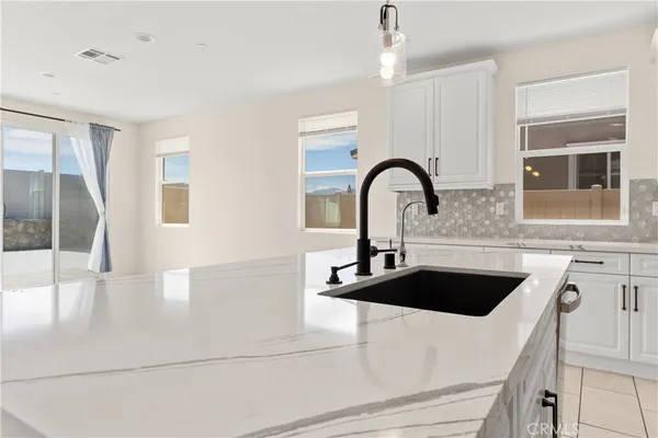 a kitchen with a sink and a stove
