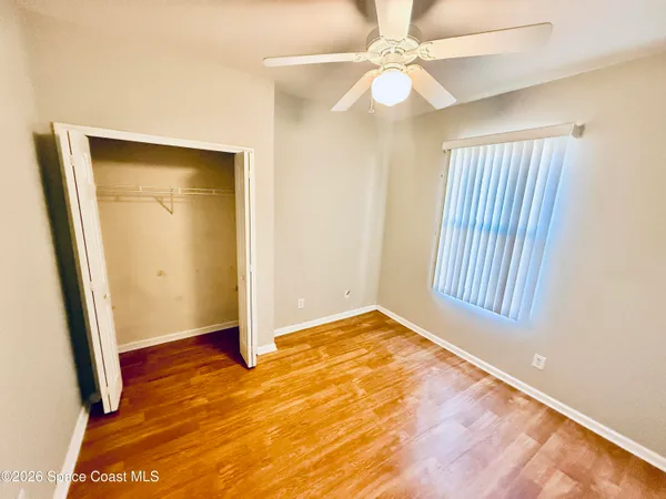 a open kitchen with stainless steel appliances granite countertop a stove top oven a sink dishwasher and a refrigerator with wooden floor