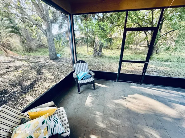 a view of an empty room with a large window