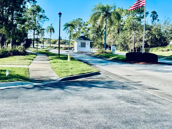 a view of a street with a bench