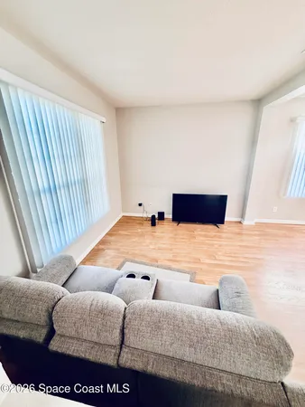 a bedroom with furniture and window