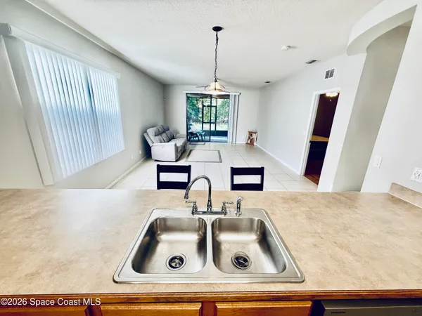a kitchen with sink and window