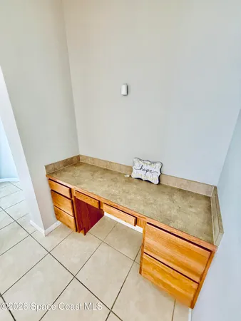 a view of a livingroom with an empty space and window