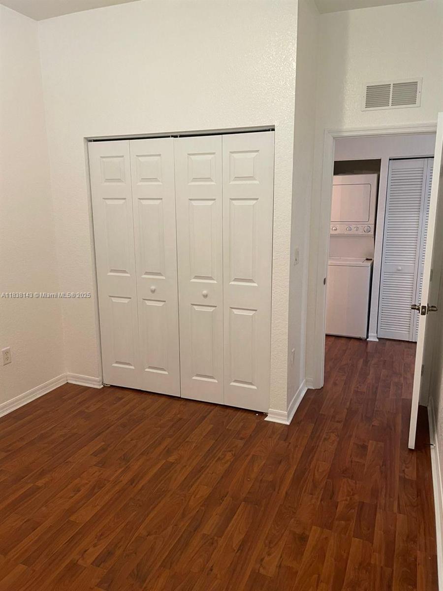 4911 Southwest 140th Terrace, Unit 6 Miramar, FL 33027 - Photo 11 of 14 an empty room with wooden floor